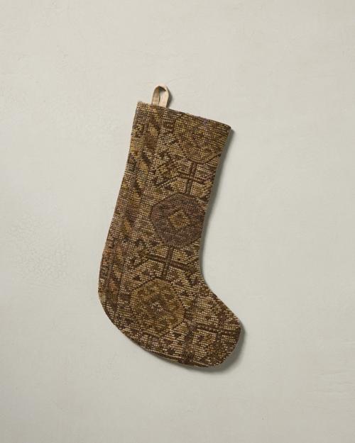 This stocking has a one-sided design and hangs with the toe facing right.
