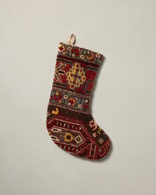 This stocking has a one-sided design and hangs with the toe facing right.