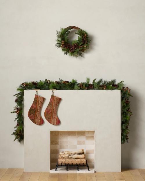 Mantel is pictured with two garland strands.