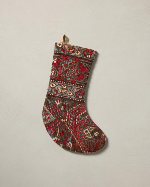 This stocking has a one-sided design and hangs with the toe facing right.