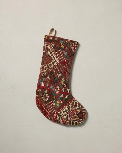 This stocking has a one-sided design and hangs with the toe facing right.