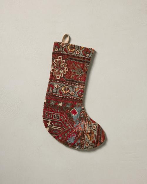 This stocking has a one-sided design and hangs with the toe facing right.