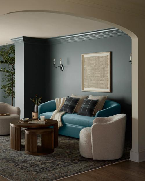 Living room vignette featuring Cosgrove Sofa, Bailey swivel chair and Sewell Nesting Table.
