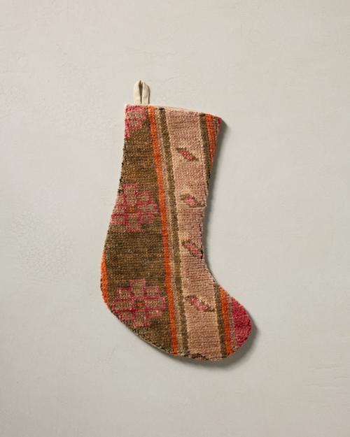This stocking has a one-sided design and hangs with the toe facing right.