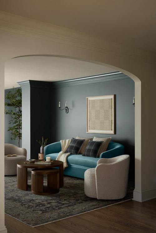 Living room vignette featuring Cosgrove Sofa, Bailey swivel chair and Sewell Nesting Table.
