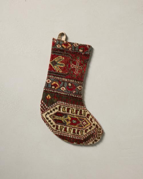 This stocking has a one-sided design and hangs with the toe facing right.