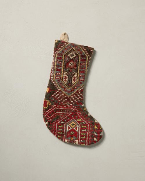 This stocking has a one-sided design and hangs with the toe facing right.