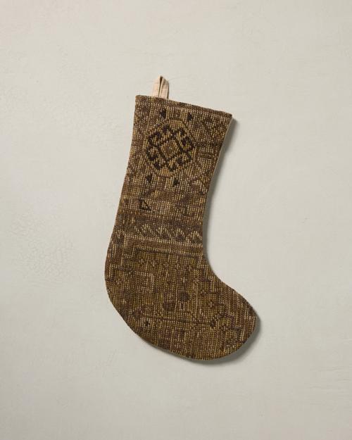 This stocking has a one-sided design and hangs with the toe facing right.